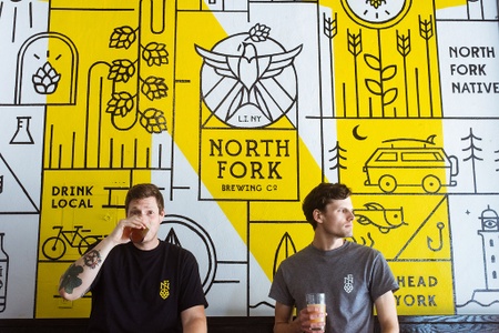 North Fork Brewing Co. - Co-owners/brewers infront of tasting room mural
