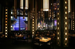 Jose Aleman - Tall Beams with Lights in Dining Area