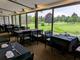 Sarnia Golf & Curling Club - Greenside with view of 18
